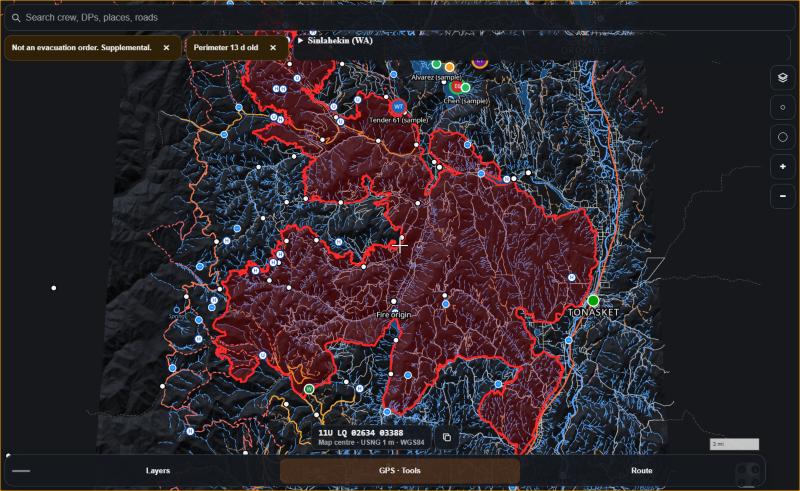 The SpikeCamp tactical map of the Sinlahekin Fire tilted in 3D, with the fire perimeter over the terrain